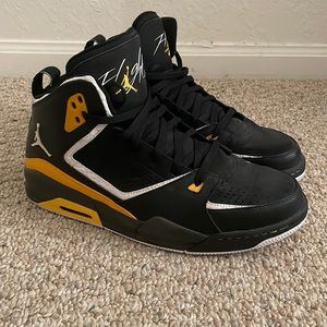 Black and yellow Jordans